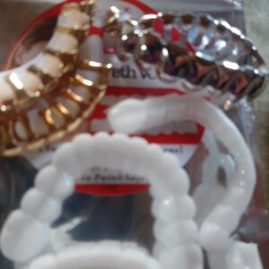 Artificial teeth gold & silver $25